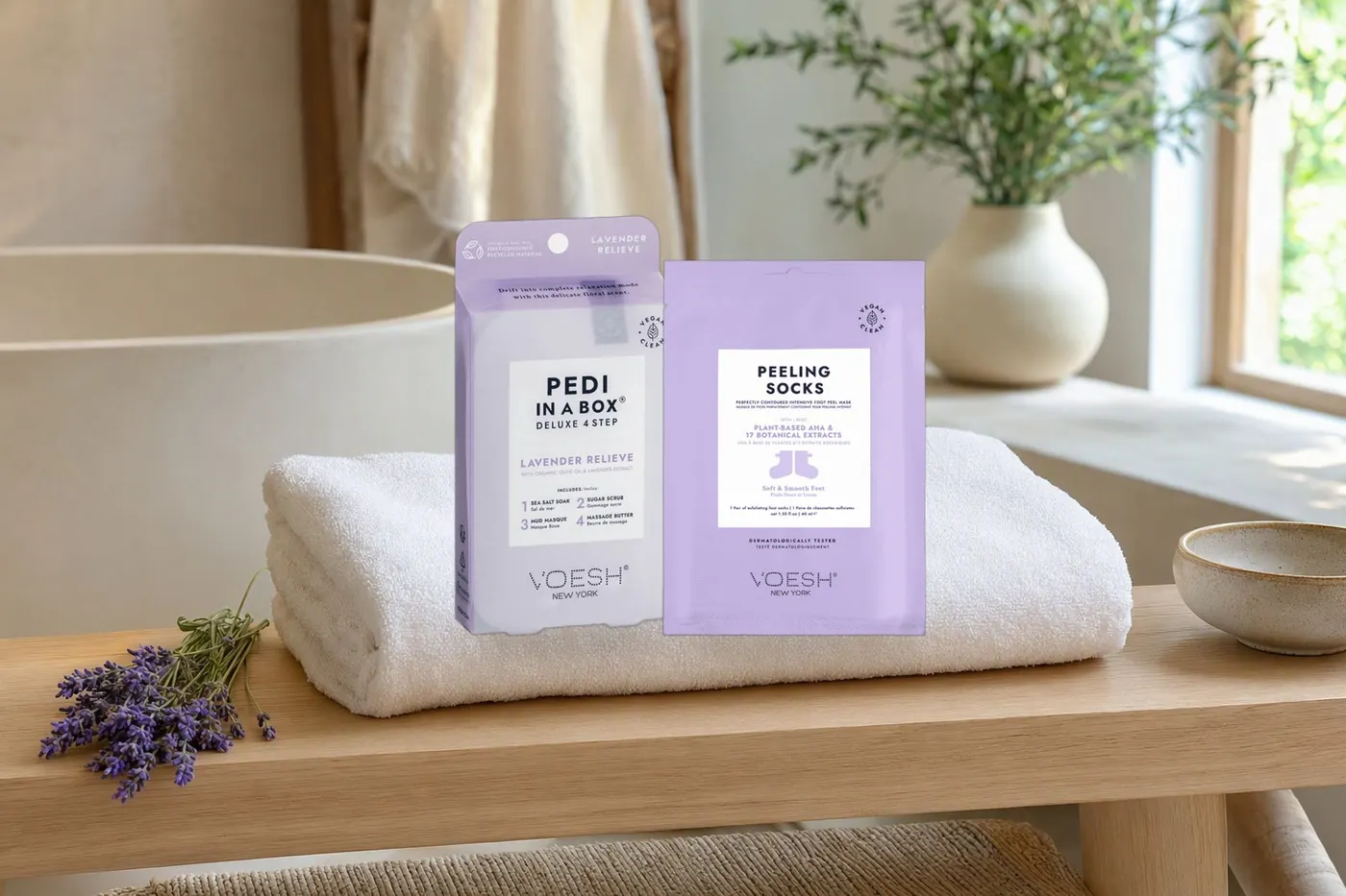 VOESH Pedi in a Box and peeling socks on a spa towel